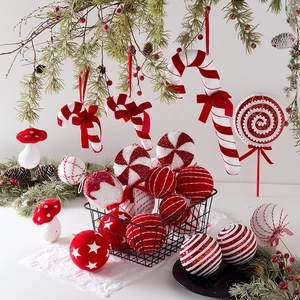 Red and white Christmas ornament set with candy canes and lollipops in a basket
