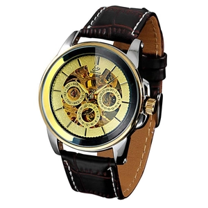 Detail of vintage hollow automatic watch with gold case and brown leather crocodile strap
