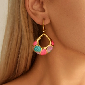 Fashionable gold teardrop earrings with colorful enamel dripping oil art worn by a model