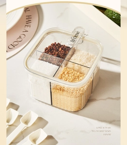 Detail of a 4-compartment seasoning box with moisture-proof lids and white spoons