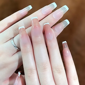 Classic French press-on nails with natural pink base and white tips in long coffin shape