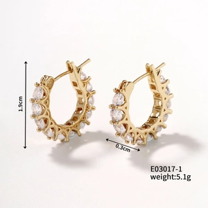 Detail view of 1.9cm gold hoop earrings with sparkling cubic zirconia inlay and clip closure