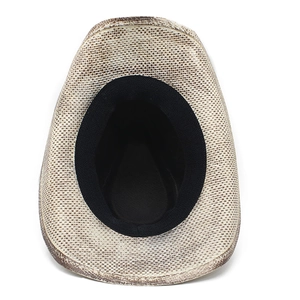 Detail view showing the woven straw texture and black inner sweatband of the cowboy hat