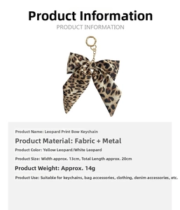 Detailed view of leopard print bow keychain with measurements 13x20cm and gold metal ring