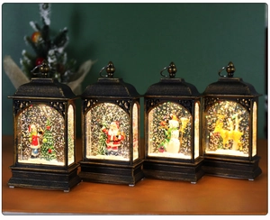 Lighted Christmas lanterns featuring Santa, snowman, elk, and tree in bronze finish