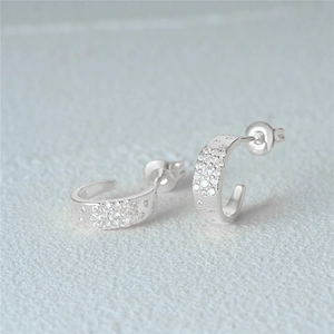 Close-up of S925 sterling silver hoop earrings with shimmering white pavé zircon stones