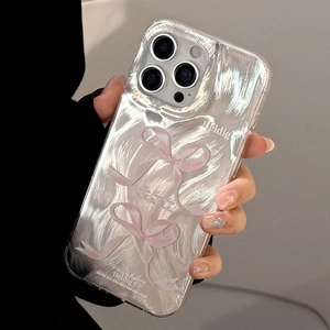 Detail showing transparent iPhone case with silver reflective texture and pink 3D bows