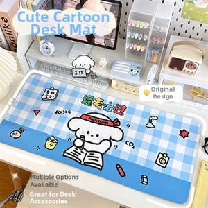Blue plaid desk mat with cartoon dog and motivational study slogans in a cozy setup
