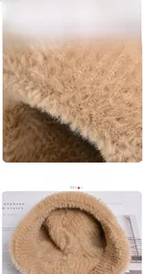 Detail of winter knit hat featuring thick plush lining and soft faux fur brim for warmth