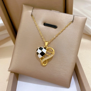 Elegant gold titanium steel necklace with houndstooth heart pendant and sparkling zircons