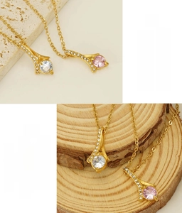 Detail of vacuum-plated stainless steel necklace with geometric rhinestone pendant
