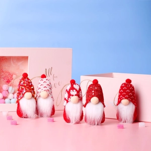 Detailed view of five handcrafted Christmas gnome ornaments with hanging loops and soft faux fur