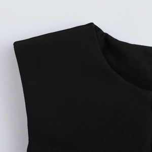 Close-up of the round neckline and knitted texture of a black sleeveless commuter vest