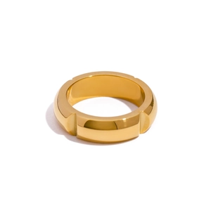 Minimalist 18k gold stainless steel ring featuring a grooved band design and metallic luster