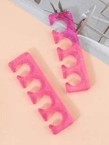 Close-up of translucent pink glitter silicone toe separators for nail polish application