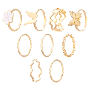 Set of nine gold rings featuring baroque pearls flowers and butterflies for women