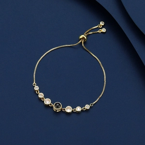 Golden projection bracelet with 100 languages I Love You and adjustable sliding clasp