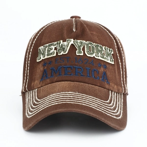 Close-up of vintage brown cotton baseball cap with New York 1624 embroidery details