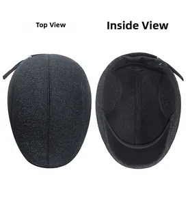 Detail view of winter grey twill wool flat cap showing the top seam and inner lining