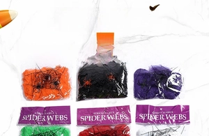 Detailed view of six colorful stretchable Halloween spider webs in individual packaging
