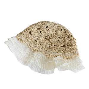 Handcrafted beige straw hat with delicate white chiffon lace ruffles for summer vacations