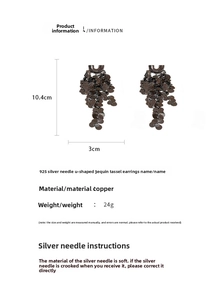 Detail view of U-shaped sequin tassel earrings with copper texture and 10.4cm length