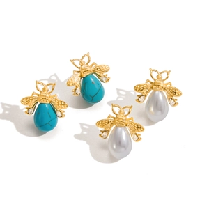 Golden bee stud earrings set with turquoise and pearls featuring sparkling zircon wings