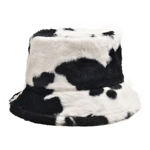 Close-up of soft plush cow print bucket hat showing thick winter faux fur texture