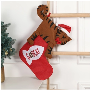 Festive tiger Christmas stocking with GOODCAT embroidery hanging on a wooden ladder