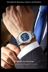 Close-up of slim silver stainless steel watch with blue sunray dial and date window