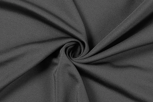 Macro shot showing high-elastic dark grey knit fabric texture with fine ribbing detail