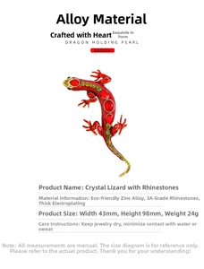 Macro shot of red lizard brooch with crystal detailing and 43mm by 98mm size dimensions