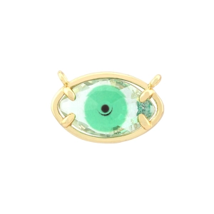 Macro shot of 18K gold plated evil eye pendant with green crystal and side connecting loops
