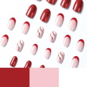 Red glitter Christmas press-on nails with silver and white swirl and French wave patterns