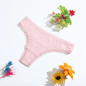 Pink low-rise cotton thong for women with ribbed texture and delicate lace trim