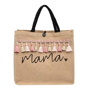 Natural jute tote bag with colorful tassels and artistic mama script print and black handles