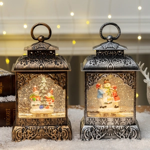 Vintage Christmas snow globe lanterns with snowman scenes and warm LED lighting effect