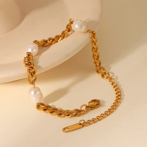 Close-up of 18K gold plated stainless steel bracelet with three elegant freshwater pearls