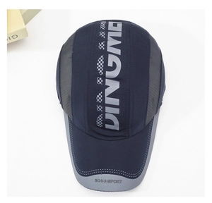 Detail view of navy quick-dry sports cap featuring printed letters and decorative strap