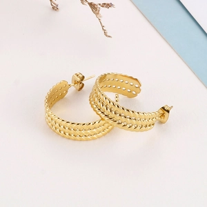 Detailed view of triple-layered twisted rope C-shaped gold-plated stainless steel earrings