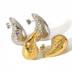 18k gold and silver hollow teardrop earrings with textured hammered finish on white background