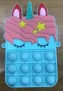 Detail view of light blue unicorn silicone pop fidget toy purse on wooden background
