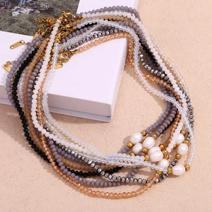 Retro beaded necklace set featuring freshwater pearls and colorful crystals with 18K gold clasp