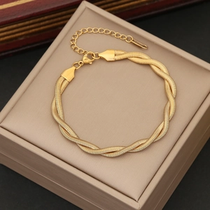 Detail of gold double-strand twisted snake chain bracelet with lobster clasp and extender