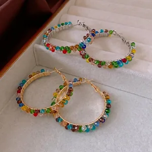 Colorful beaded hoop earrings with vibrant crystals in gold and silver finish