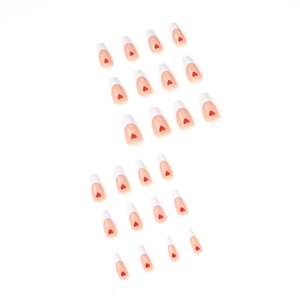 French tip press on nails with red heart patterns on a long coffin shape set