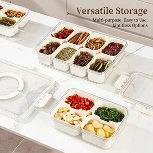 Clear 8-compartment kitchen spice organizer with airtight lid on marble countertop