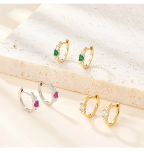 Macro shot of S925 sterling silver hoop earrings with colorful zircon stones