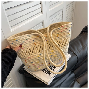 Detail of hand-woven cotton tote bag with colorful 3D dots and boho style texture