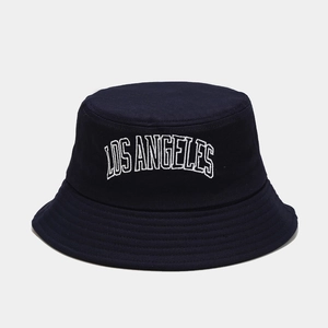 Close-up of navy bucket hat featuring white Los Angeles embroidery and reinforced stitching